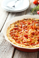 Fresh tomato pie on grey wooden background