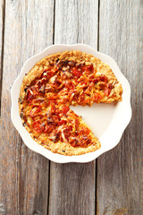 Fresh tomato pie on grey wooden background