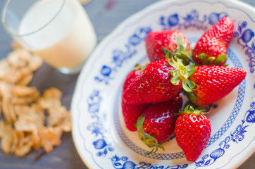 Biscuits, cornflakes, strawberry and milk
