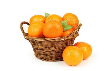 Mandarin in basket isolated on white