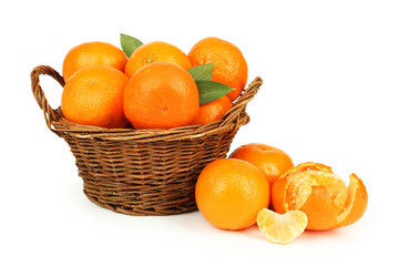 Mandarin in basket isolated on white