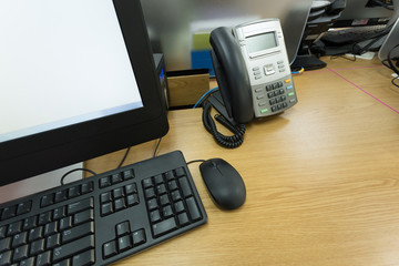 table work in office with telephone and computer pc