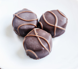 Tasty chocolate bonbon isolated on a white background