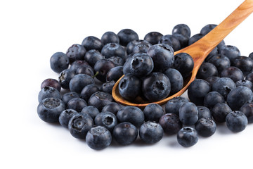 Fresh blueberries in wooden spoon