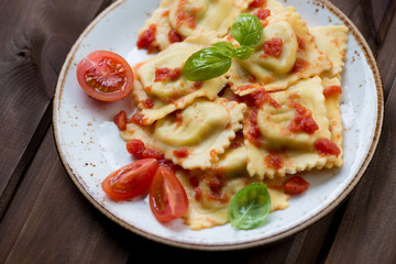 Ravioli stuffed with mozzarella and served with tomato sauce