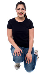 Beautiful woman crouched down on knees
