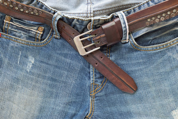 blue jeans with brown leather belt