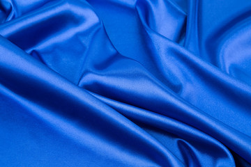 Blue silk drapery close up.