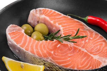 Fresh salmon steak on pan.