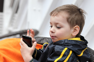 Child playing with smartphone