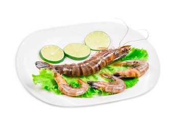Raw shrimps on plate.