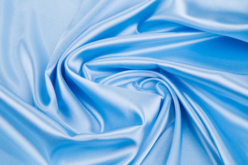 Blue silk cloth texture closeup.