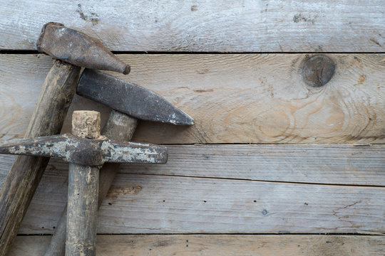 Wooden background with a hammer, home improvement concept
