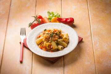 pasta with mixed vegetables and pine nuts