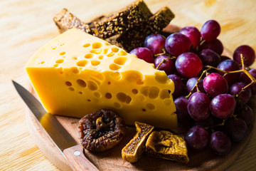 Cheese with grapes and figs