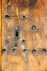 Door lock on a wooden door, old style.