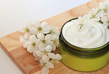 jar of herbal moisturizing skin cream flowers organic