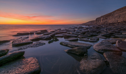Spectacular Sunset over rock pools on a British beach