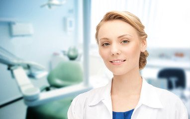 happy young female dentist with tools