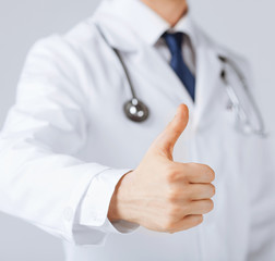male doctor hand showing thumbs up