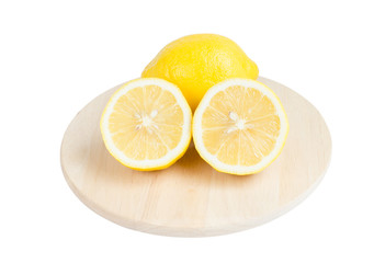 Lemon and slice on wooden board isolate on white with clipping p