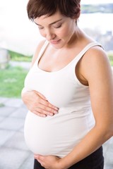 Pregnant woman holding her bump