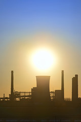 Fototapeta na wymiar silhouette of industrial factory at sunset