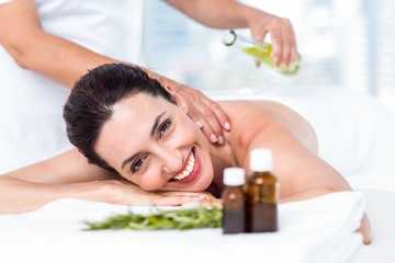 Obraz na płótnie Canvas Smiling woman getting an aromatherapy treatment