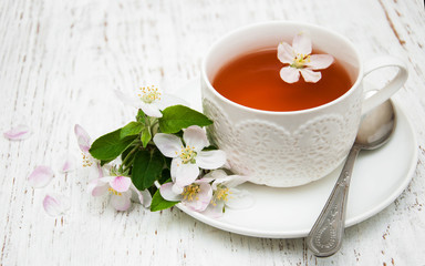 Cup of tea and spring blossom