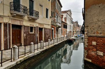 Fototapeta na wymiar Canal and Historic Houses in Venice, Italy