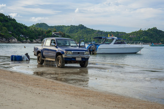 4x4 and boat on a beach