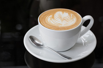 hot coffee latte, latte art with heart in a white cup