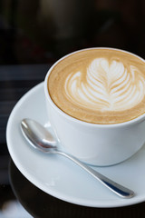 hot coffee latte, latte art with heart in a white cup