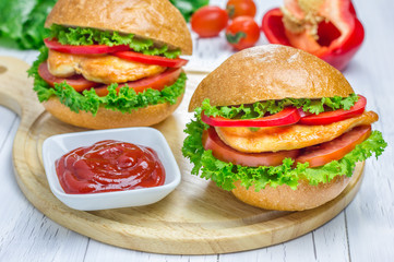 Sandwiches with roast chicken fillet, tomato and paprika