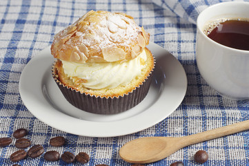 Coffee and creamy cake with nuts