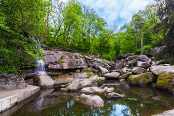 Fototapeta na wymiar landscape lake with a waterfall