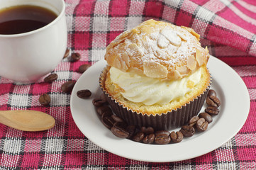 Coffee and creamy cake with nuts