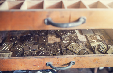 Letters for engraving in an old drawer 
