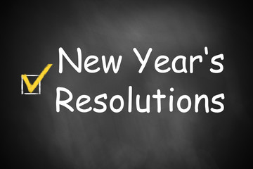 Obraz premium New Year's resolutions written on black chalkboard checkbox