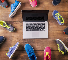 Running shoes and notebook on a wooden floor background - Powered by Adobe