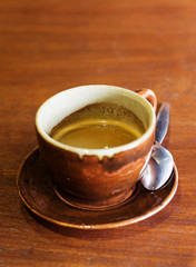 Coffee cup on wood table.