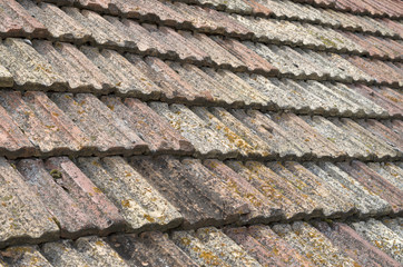 Old roof with ceramic tiles closeup