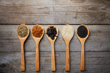Spices on wood spoons