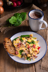 Scrambled eggs with tomatoes and spinach