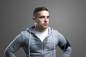 Obraz premium Handsome young runner. Studio shot on gray background.