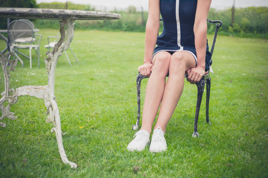 Woman relaxing on chair in a garden