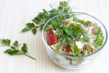 Salad: tomatos, cucumber, dill, parsley, cheese, sesame