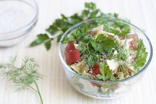 Salad: tomatos, cucumber, dill, parsley, cheese, sesame