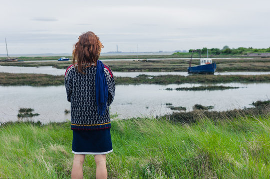 Woman walking in marshes