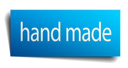 hand made blue paper sign on white background